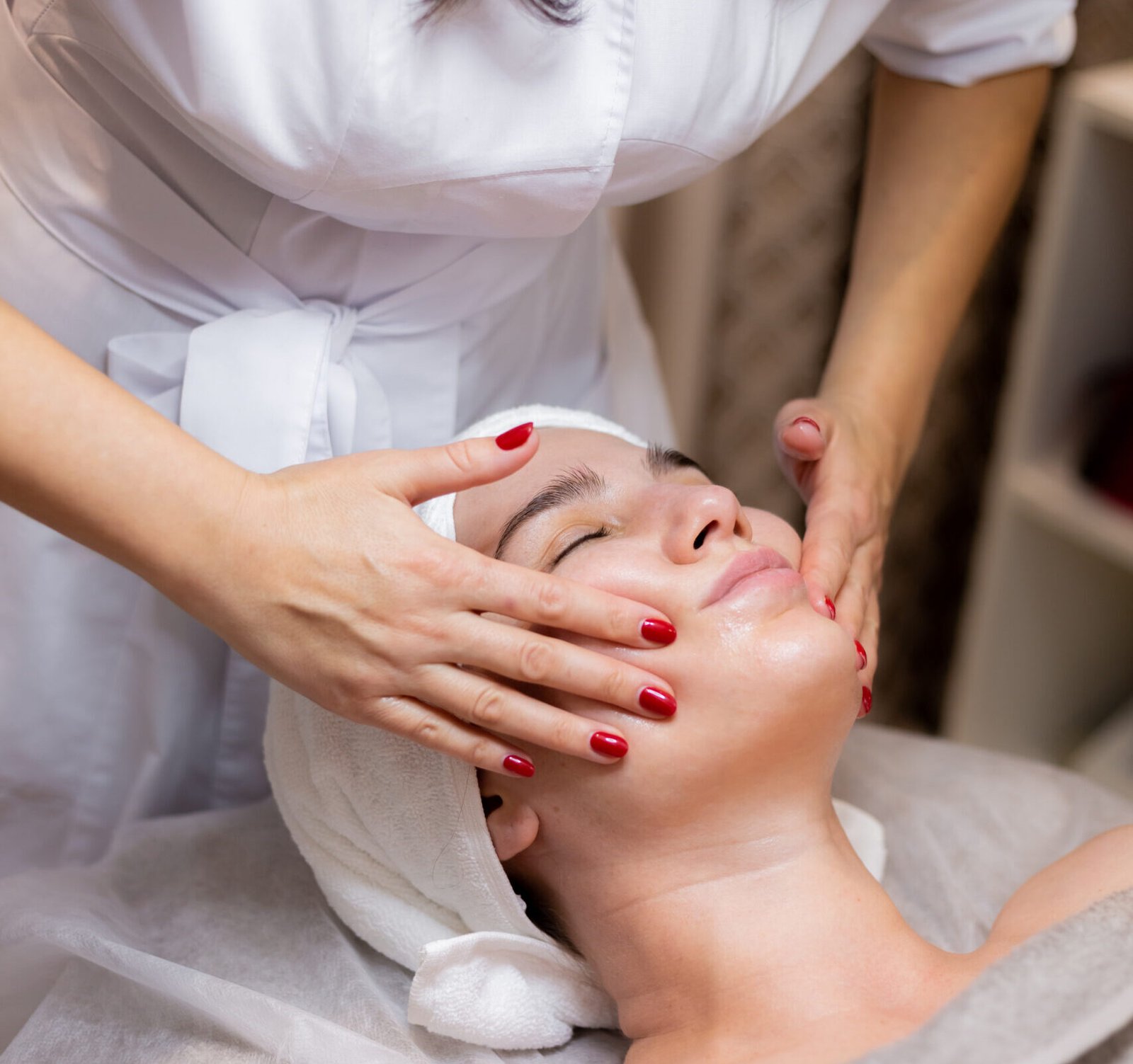 young beautiful girl lies beautician s table receives procedures light facial massage scaled e1753886313579